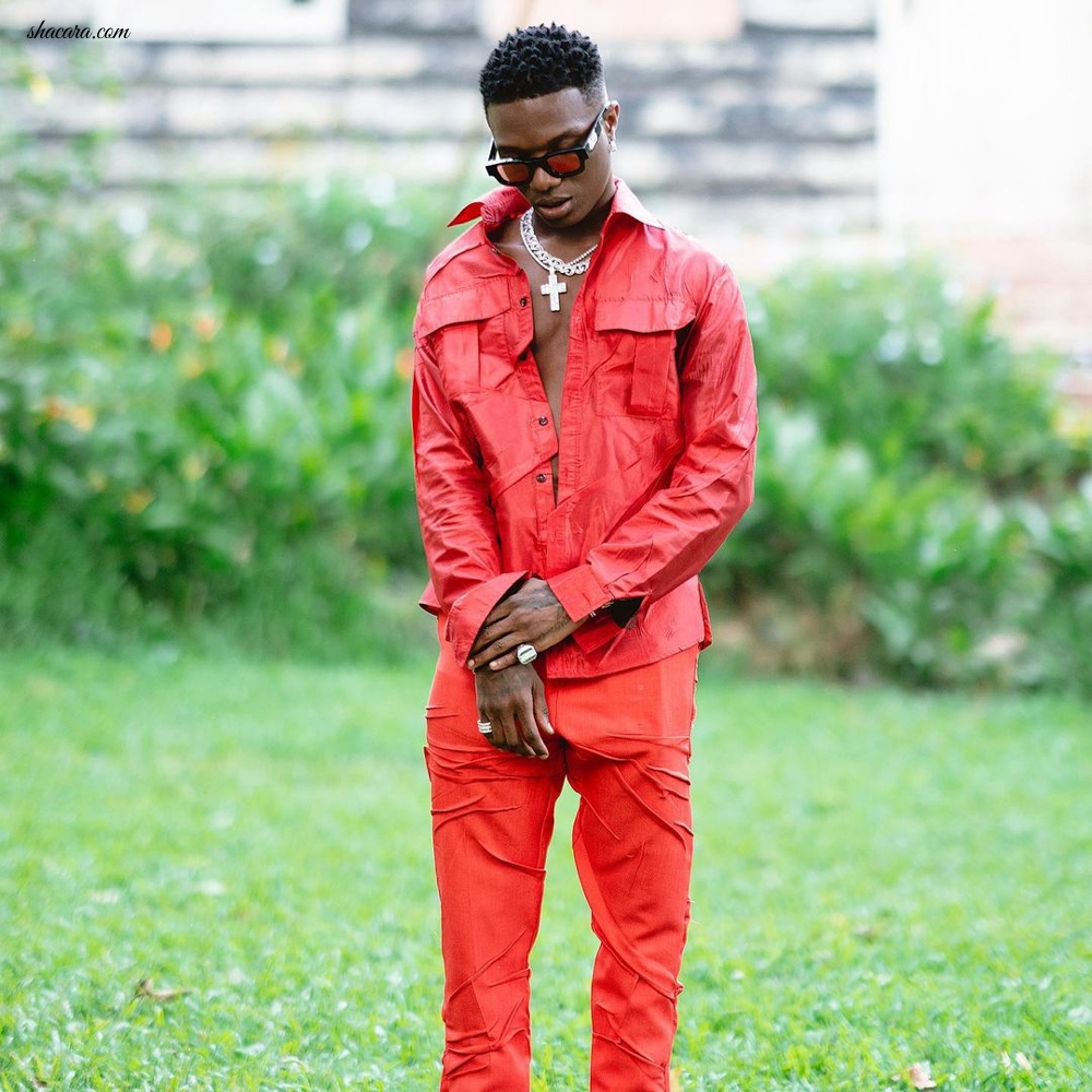 Singer WizKid Dons an Extravagant All Red Relaxed Ensemble